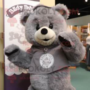Gray Teddy Bear mascot costume character dressed with a Henley Tee and Shawl pins