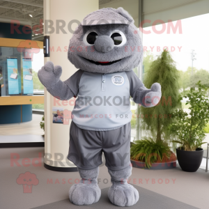 Gray Raspberry mascot costume character dressed with a Polo Shirt and Belts