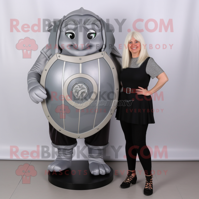 Gray Celtic Shield mascot costume character dressed with a Blouse and Foot pads