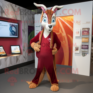 Maroon Gazelle mascot costume character dressed with a Graphic Tee and Wraps