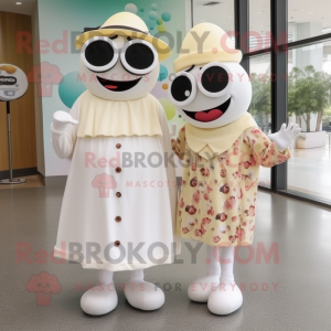 Cream Cyclops mascot costume character dressed with a Maxi Dress and Berets