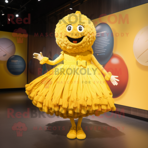Yellow Meatballs mascot costume character dressed with a Pleated Skirt and Brooches