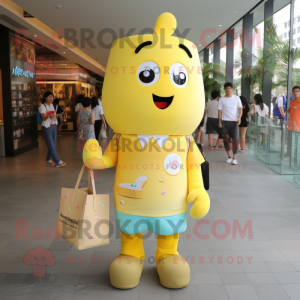 Yellow Ice Cream mascot costume character dressed with a Button-Up Shirt and Tote bags