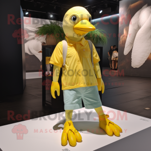 Yellow Pigeon mascot costume character dressed with a Tank Top and Shoe laces