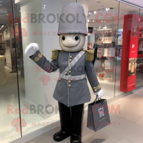 Silver British Royal Guard mascot costume character dressed with a Suit Pants and Tote bags