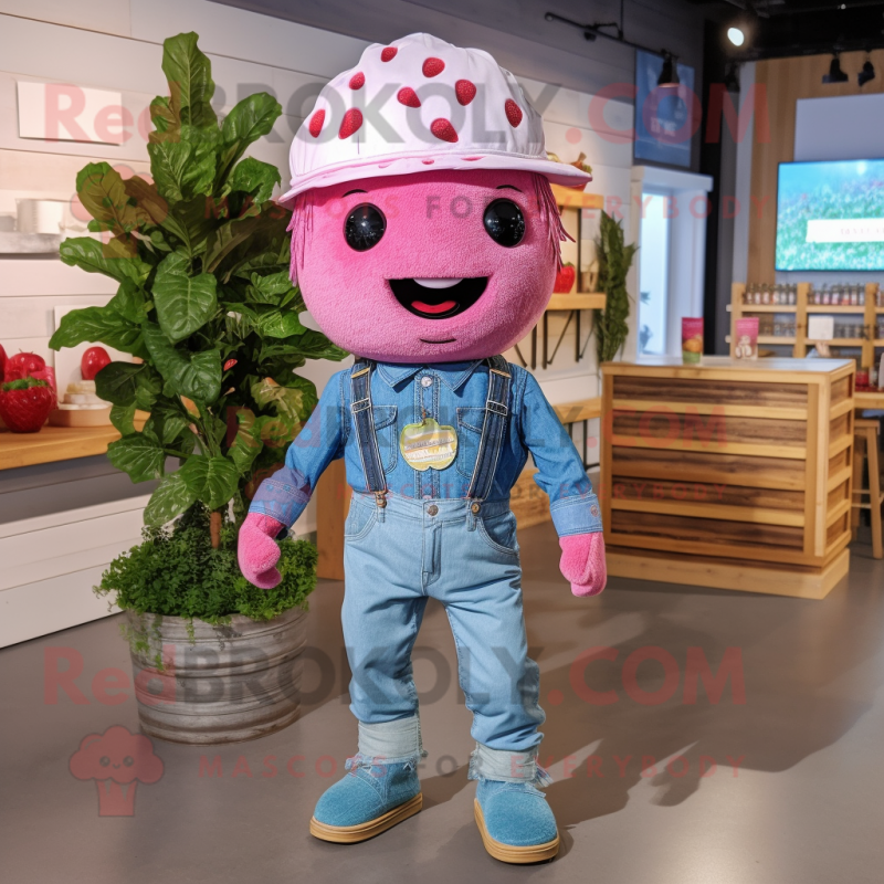 Pink Raspberry mascot costume character dressed with a Chambray Shirt and Headbands