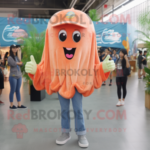 Peach Jellyfish mascot costume character dressed with a Denim Shirt and Shawl pins