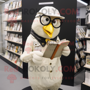 Cream Blackbird mascot costume character dressed with a Overalls and Reading glasses