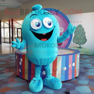 Turquoise Candy Box mascot costume character dressed with a Cover-up and Rings