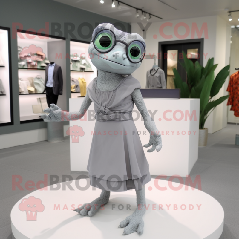 Gray Geckos mascot costume character dressed with a Midi Dress and Eyeglasses