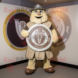 Beige Celtic Shield mascot costume character dressed with a Graphic Tee and Ties