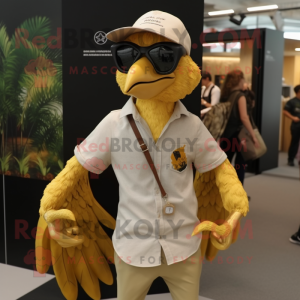 Gold Archeopteryx mascot costume character dressed with a Oxford Shirt and Sunglasses