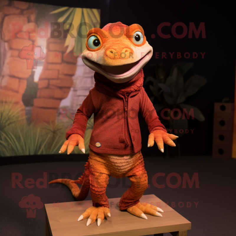 Rust Geckos mascot costume character dressed with a Sweater and Foot pads