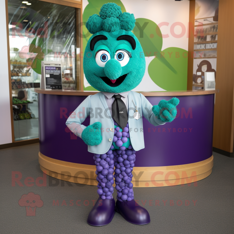 Teal Grape mascot costume character dressed with a Skirt and Cufflinks