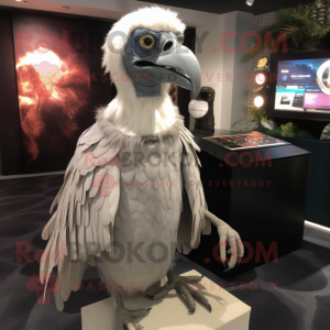 Silver Vulture mascot costume character dressed with a Button-Up Shirt and Shawl pins