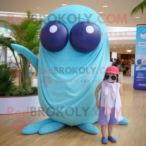 Tan Blue Whale mascot costume character dressed with a Bikini and Wraps
