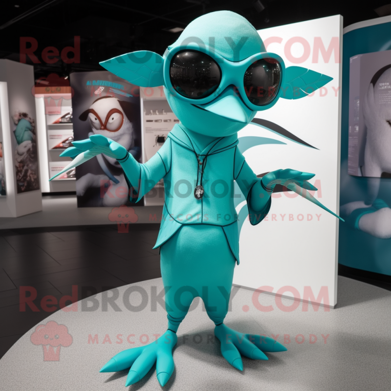 Turquoise Pterodactyl mascot costume character dressed with a Playsuit and Eyeglasses