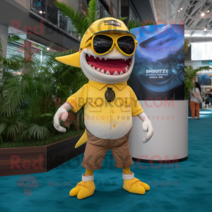 Yellow Megalodon mascot costume character dressed with a Bermuda Shorts and Eyeglasses