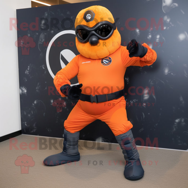 Orange Navy Seal mascot costume character dressed with a Leggings and Rings