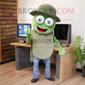 Olive Computer mascot costume character dressed with a Jeans and Hats
