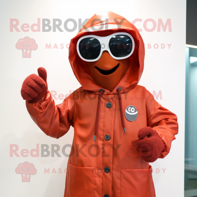 Rust Raspberry mascot costume character dressed with a Raincoat and Sunglasses