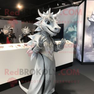 Silver Dragon mascot costume character dressed with a Midi Dress and Rings