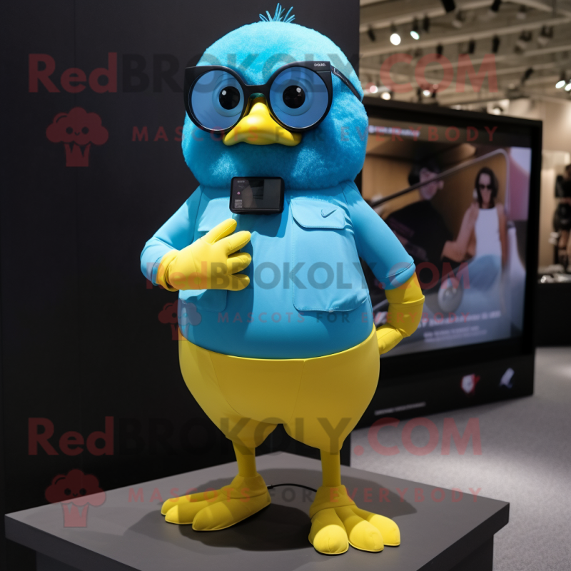 Sky Blue Canary mascot costume character dressed with a Shorts and Smartwatches