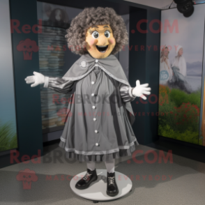 Gray Irish Dancer mascot costume character dressed with a Raincoat and Shawl pins