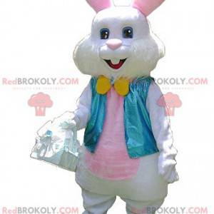 Mascotte de lapin blanc et rose avec un gilet bleu -
