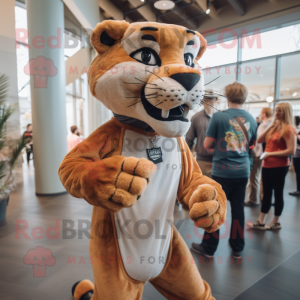 Rust Mountain Lion mascot costume character dressed with a Jeggings and Hair clips