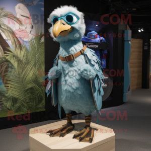 Sky Blue Vulture mascot costume character dressed with a Board Shorts and Brooches