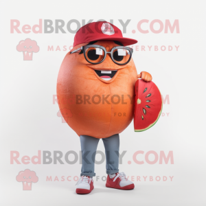 Red Grapefruit mascot costume character dressed with a Jeans and Eyeglasses