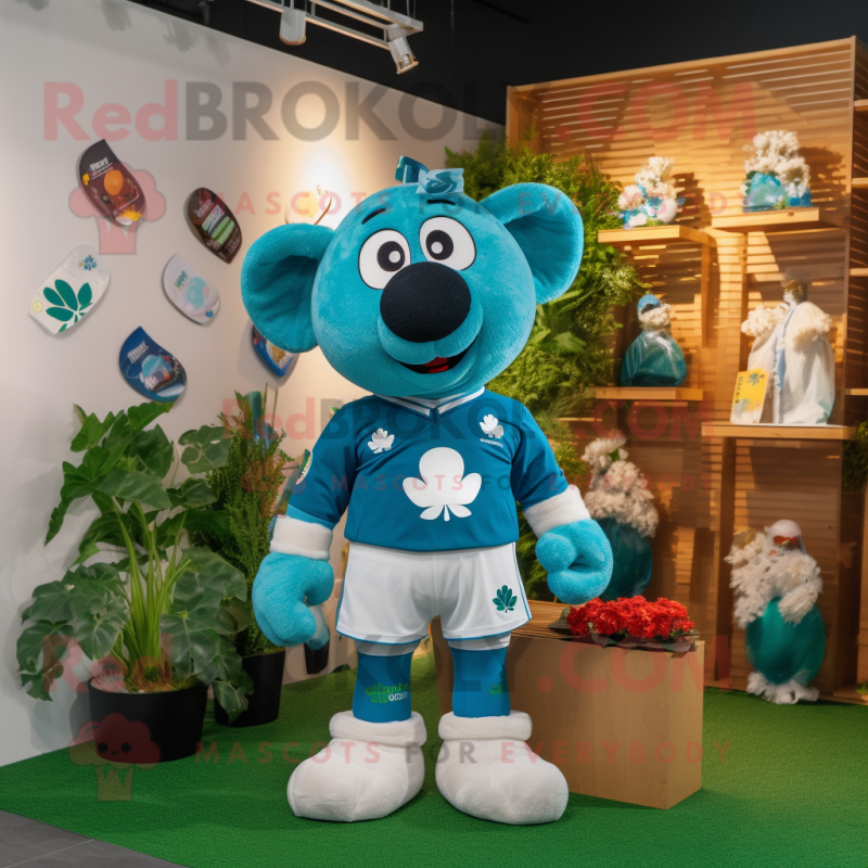 Turquoise Four Leaf Clover mascot costume character dressed with a Rugby Shirt and Keychains