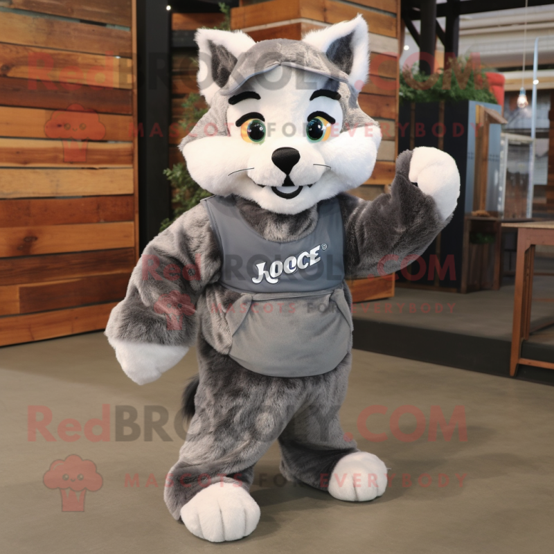 Gray Bobcat mascot costume character dressed with a Overalls and Shawls