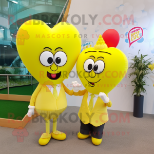 Lemon Yellow Heart Shaped Balloons mascot costume character dressed with a Maxi Skirt and Pocket squares