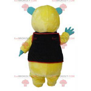 Mascotte de nounours jaune vert et blanc avec un gilet noir -