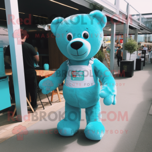 Turquoise Teddy Bear mascot costume character dressed with a Dungarees and Clutch bags