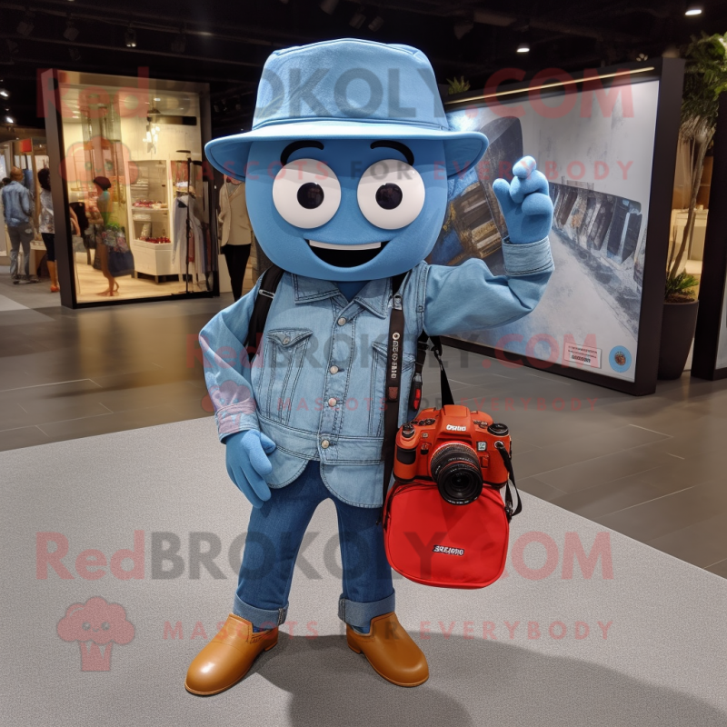 Blue Camera mascot costume character dressed with a Denim Shirt and Tote bags