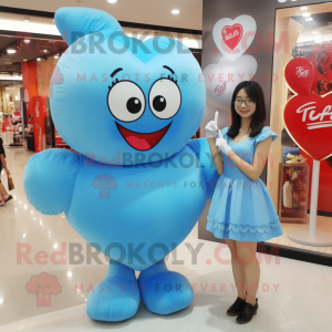 Sky Blue Heart mascot costume character dressed with a Mini Dress and Watches