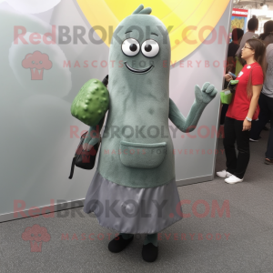 Gray Cucumber mascot costume character dressed with a Shift Dress and Clutch bags
