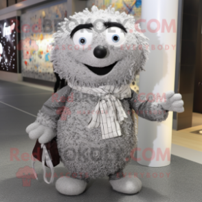 Silver Meatballs mascot costume character dressed with a Cardigan and Clutch bags