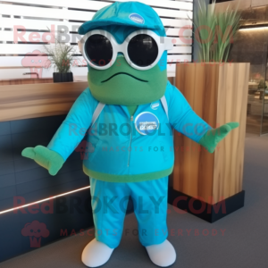 Turquoise Cod mascot costume character dressed with a Overalls and Sunglasses