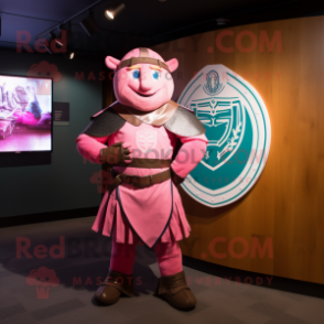 Pink Celtic Shield mascot costume character dressed with a Rash Guard and Ties