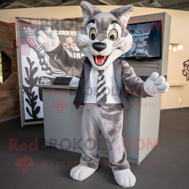 Gray Bobcat mascot costume character dressed with a Blazer and Headbands