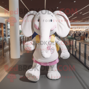 Cream Elephant mascot costume character dressed with a Yoga Pants and Handbags