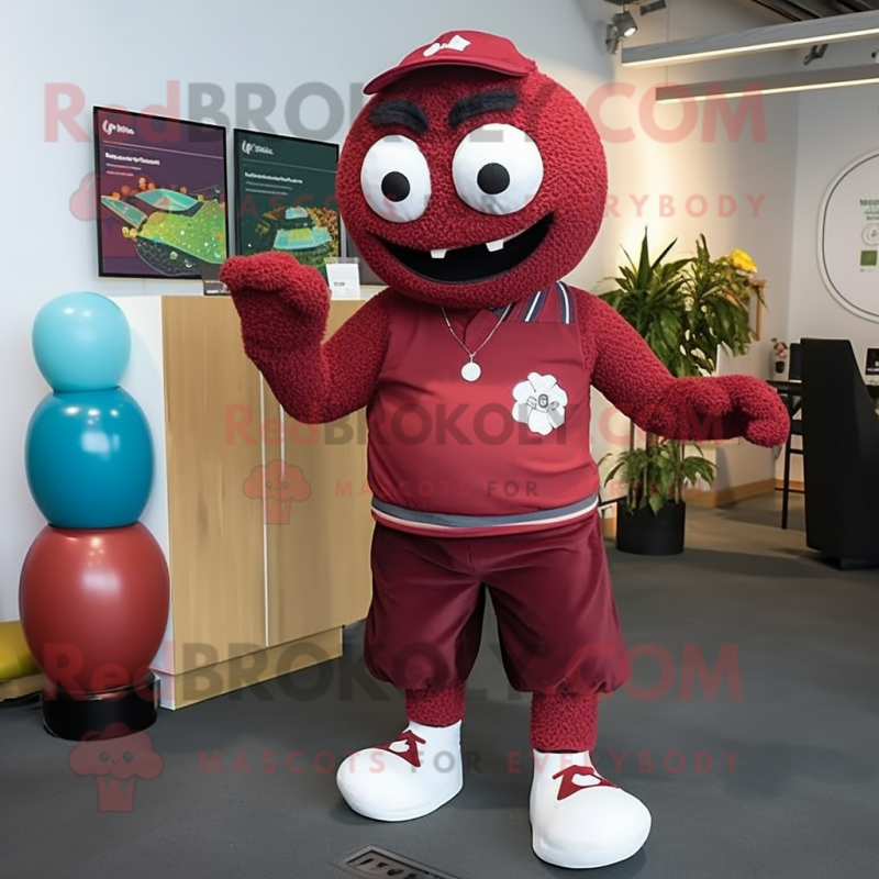 Maroon Juggle mascot costume character dressed with a Rash Guard and Anklets