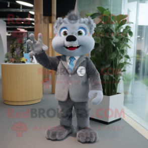 Gray But mascot costume character dressed with a Suit Jacket and Brooches