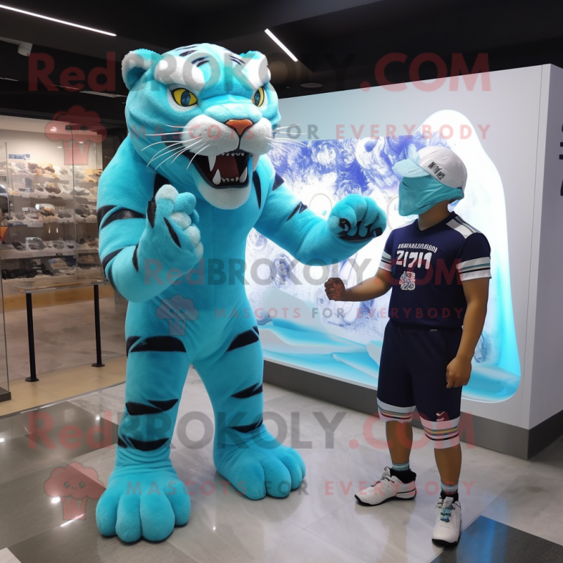 Cyan Saber-Toothed Tiger mascot costume character dressed with a Rash Guard and Watches