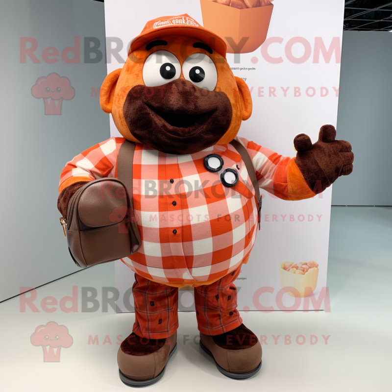 Orange Chocolates mascot costume character dressed with a Flannel Shirt and Tote bags