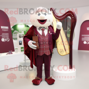 Maroon Celtic harp mascot costume character dressed with Suit Jacket and Brooches